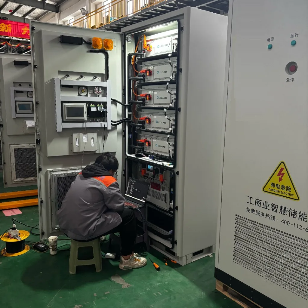 Technician commissioning industrial smart energy storage systems